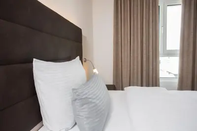 Ein Bett oder Betten in einem Zimmer der Unterkunft Hotel am Campus