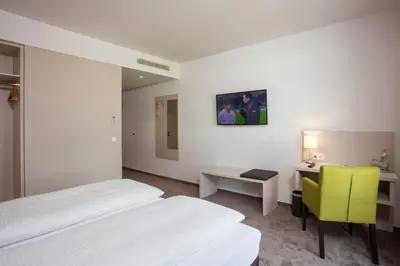Ein Bett oder Betten in einem Zimmer der Unterkunft Hotel am Campus