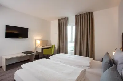 Ein Bett oder Betten in einem Zimmer der Unterkunft Hotel am Campus