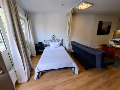 Ein Bett oder Betten in einem Zimmer der Unterkunft East Park Apartments Baumkirchner Str 18