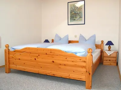 Ein Bett oder Betten in einem Zimmer der Unterkunft Utznhof