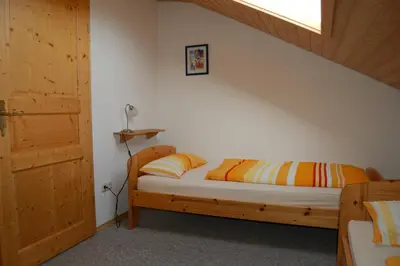 Ein Bett oder Betten in einem Zimmer der Unterkunft Utznhof