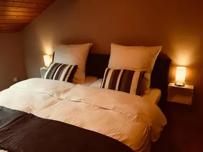 Ein Bett oder Betten in einem Zimmer der Unterkunft Buchwinklblick