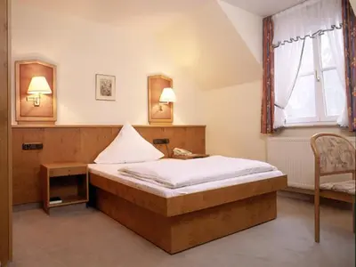 Ein Bett oder Betten in einem Zimmer der Unterkunft Hotel 