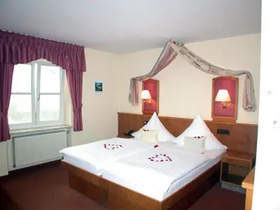 Ein Bett oder Betten in einem Zimmer der Unterkunft Hotel 
