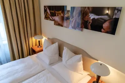 Ein Bett oder Betten in einem Zimmer der Unterkunft Hotel Olympic