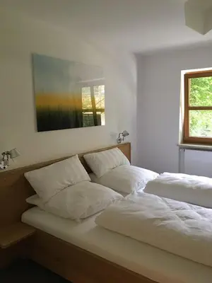 Ein Bett oder Betten in einem Zimmer der Unterkunft Premium-Chalet Achental mit Kamin und Sauna