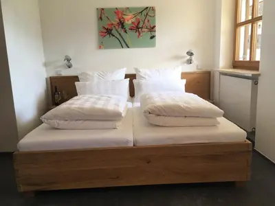 Ein Bett oder Betten in einem Zimmer der Unterkunft Premium-Chalet Achental mit Kamin und Sauna