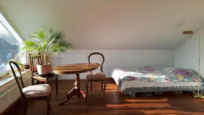 Ein Bett oder Betten in einem Zimmer der Unterkunft helles Dachstudio