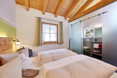 Ein Bett oder Betten in einem Zimmer der Unterkunft Ferienhaus Alpinissimo