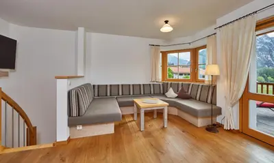 Ein Sitzbereich in der Unterkunft Ferienhaus Alpinissimo