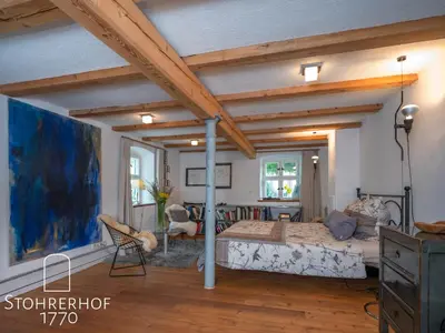 Ein Sitzbereich in der Unterkunft 5 Sterne Ferienhaus Gut Stohrerhof am Ammersee in Bayern bis 11 Personen