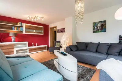 Ein Sitzbereich in der Unterkunft Apartmenthaus am Erlbach