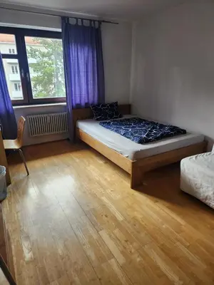 Ein Bett oder Betten in einem Zimmer der Unterkunft Oktoberfest