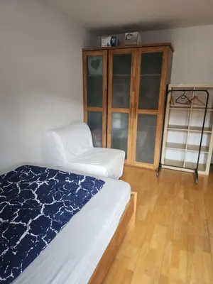 Ein Bett oder Betten in einem Zimmer der Unterkunft Oktoberfest