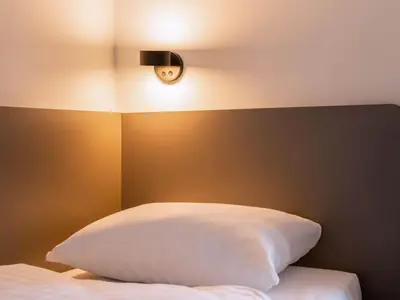 Ein Bett oder Betten in einem Zimmer der Unterkunft B&B HOTEL München-Airport