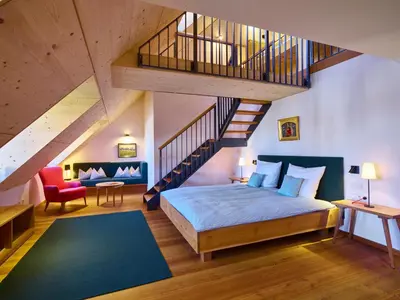 Ein Bett oder Betten in einem Zimmer der Unterkunft Romantik Hotel Zum Klosterbräu