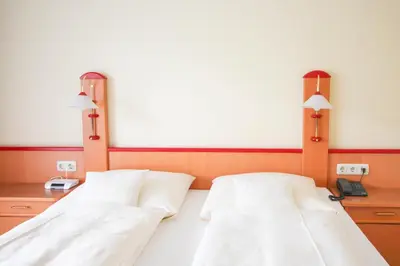 Ein Bett oder Betten in einem Zimmer der Unterkunft Hotel Brandl
