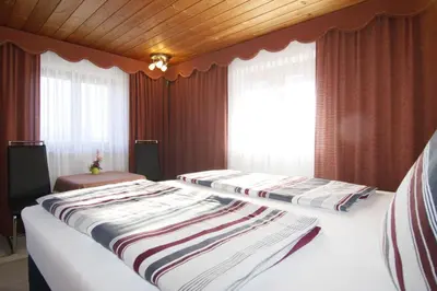 Ein Bett oder Betten in einem Zimmer der Unterkunft Gästehaus Kirner - Bad Feilnbach
