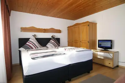 Ein Bett oder Betten in einem Zimmer der Unterkunft Gästehaus Kirner - Bad Feilnbach