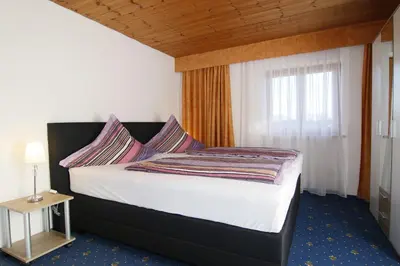 Ein Bett oder Betten in einem Zimmer der Unterkunft Gästehaus Kirner - Bad Feilnbach