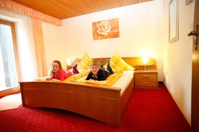Ein Bett oder Betten in einem Zimmer der Unterkunft Gästehaus Kirner - Bad Feilnbach