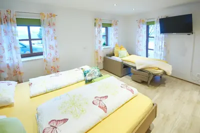Ein Bett oder Betten in einem Zimmer der Unterkunft Stadel Hof Altötting