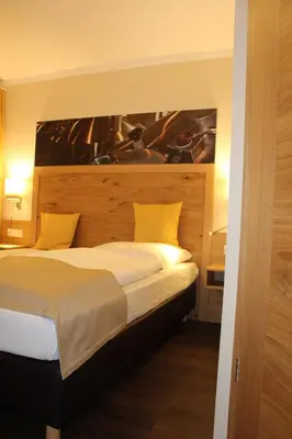 Ein Bett oder Betten in einem Zimmer der Unterkunft Hotel Brauereigasthof Amberger