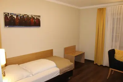 Ein Bett oder Betten in einem Zimmer der Unterkunft Hotel Brauereigasthof Amberger