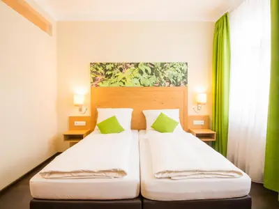 Ein Bett oder Betten in einem Zimmer der Unterkunft Hotel Brauereigasthof Amberger
