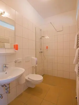 Ein Badezimmer in der Unterkunft Hotel Brauereigasthof Amberger