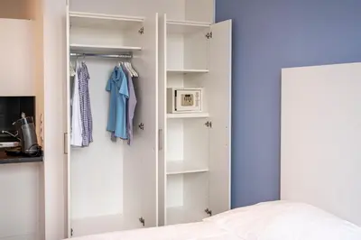Ein Bett oder Betten in einem Zimmer der Unterkunft apartmenthaus international
