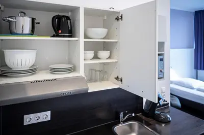 Ein Bett oder Betten in einem Zimmer der Unterkunft apartmenthaus international