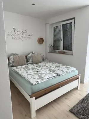 Ein Bett oder Betten in einem Zimmer der Unterkunft Gemütliche Ferienwohnung mit Charme