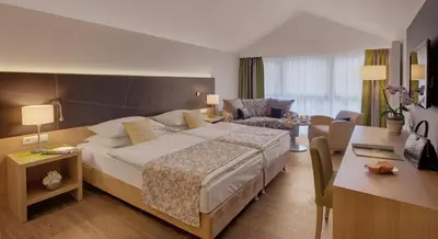Ein Bett oder Betten in einem Zimmer der Unterkunft Hotel Holl