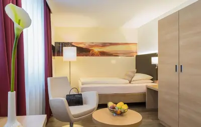 Ein Bett oder Betten in einem Zimmer der Unterkunft Hotel Holl