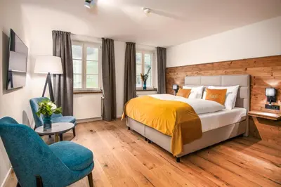 Ein Bett oder Betten in einem Zimmer der Unterkunft Terofal Hotel Schliersee - Komplett neu renoviert