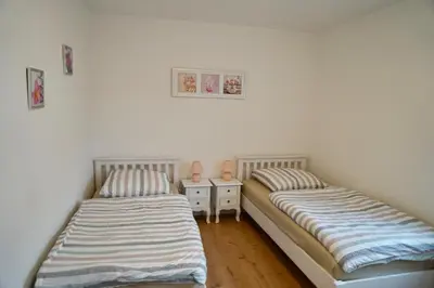 Ein Bett oder Betten in einem Zimmer der Unterkunft M&A Ferienwohnungen Oberbayern