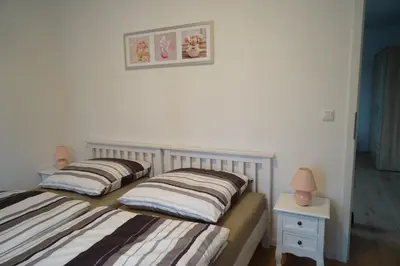 Ein Bett oder Betten in einem Zimmer der Unterkunft M&A Ferienwohnungen Oberbayern