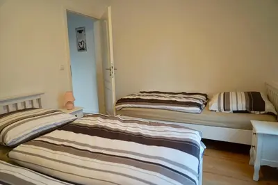 Ein Bett oder Betten in einem Zimmer der Unterkunft M&A Ferienwohnungen Oberbayern