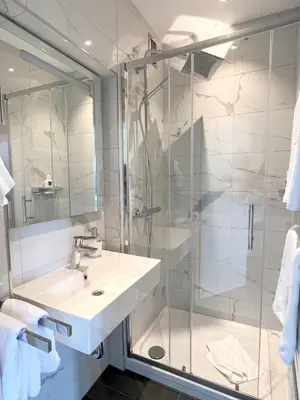 Ein Badezimmer in der Unterkunft Hotel Schlossblick Chiemsee