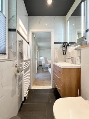 Ein Badezimmer in der Unterkunft Hotel Schlossblick Chiemsee