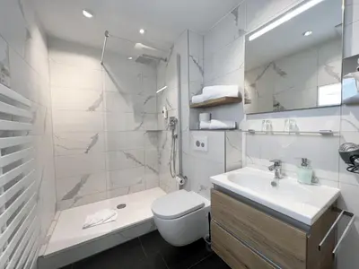 Ein Badezimmer in der Unterkunft Hotel Schlossblick Chiemsee