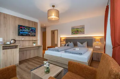 Ein Bett oder Betten in einem Zimmer der Unterkunft Boutique Hotel Angerer