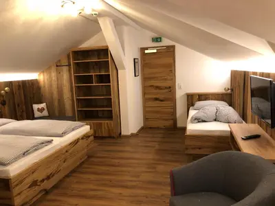 Ein Bett oder Betten in einem Zimmer der Unterkunft Berggasthof Obere Firstalm