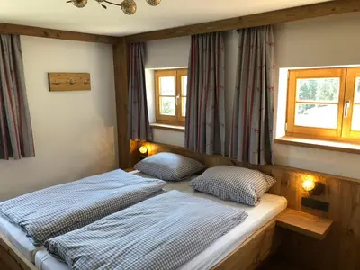 Ein Bett oder Betten in einem Zimmer der Unterkunft Berggasthof Obere Firstalm