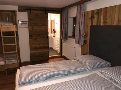 Ein Bett oder Betten in einem Zimmer der Unterkunft Berggasthof Obere Firstalm