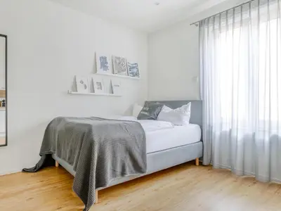 Ein Bett oder Betten in einem Zimmer der Unterkunft Limehome Augsburg Am Katzenstadel