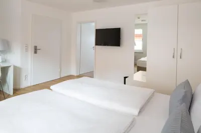 Ein Bett oder Betten in einem Zimmer der Unterkunft Hotel am alten Park