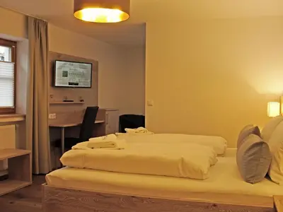 Ein Bett oder Betten in einem Zimmer der Unterkunft Mammhofer Suite & Breakfast